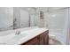 Clean bathroom with a shower/tub combo and wood vanity at 10581 Olinda St, Las Vegas, NV 89179