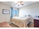 Spacious bedroom with large bed, window, and ceiling fan at 10581 Olinda St, Las Vegas, NV 89179