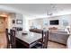 Open concept dining area with hardwood floors and view into living room at 10581 Olinda St, Las Vegas, NV 89179