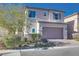 Two-story house with attached garage and landscaped front yard at 10581 Olinda St, Las Vegas, NV 89179