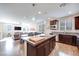 Spacious kitchen with island, stainless steel appliances, and dark wood cabinetry at 10581 Olinda St, Las Vegas, NV 89179