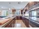 Kitchen with island, stainless steel appliances, and granite countertops at 10581 Olinda St, Las Vegas, NV 89179