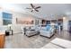 Bright and airy living room with hardwood floors and ceiling fan at 10581 Olinda St, Las Vegas, NV 89179