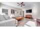 Light-filled living room with hardwood floors and a neutral color scheme at 10581 Olinda St, Las Vegas, NV 89179