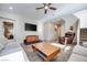 Living room with hardwood floors, sectional sofa, and ceiling fan at 10581 Olinda St, Las Vegas, NV 89179