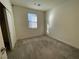 Well-lit bedroom with carpet flooring and ample closet space at 11751 Emerald Lake Ave, Las Vegas, NV 89138