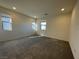 Spacious bedroom with neutral walls and carpet, featuring multiple windows at 11751 Emerald Lake Ave, Las Vegas, NV 89138