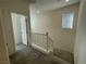 Upstairs hallway with carpet and door to bedroom at 11751 Emerald Lake Ave, Las Vegas, NV 89138