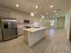 Modern kitchen with island, stainless steel appliances, and light gray cabinets at 11751 Emerald Lake Ave, Las Vegas, NV 89138