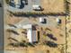 Aerial view showing house, outbuildings, and surrounding land at 1230 Bruce St, Pahrump, NV 89048