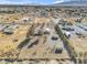 Aerial view showing home, outbuildings, and expansive lot at 1230 Bruce St, Pahrump, NV 89048