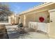 Front entry with decorative door and potted plants at 1230 Bruce St, Pahrump, NV 89048