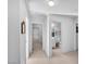 Hallway with access to bedrooms and laundry at 1230 Bruce St, Pahrump, NV 89048