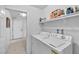 Laundry room with washer, dryer, and extra storage shelving at 1230 Bruce St, Pahrump, NV 89048