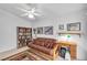 Home office featuring a futon, bookcase, and writing desk at 1230 Bruce St, Pahrump, NV 89048