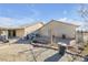 Side yard with storage shed and chain link fence at 1230 Bruce St, Pahrump, NV 89048