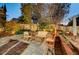 Evening view of backyard with patio, seating area and lighting at 1259 Moon Vision St, Henderson, NV 89052