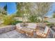 Relaxing backyard patio with seating area and manicured landscaping at 1259 Moon Vision St, Henderson, NV 89052