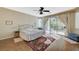 Main bedroom with wood floors, sliding glass doors to patio, and ceiling fan at 1259 Moon Vision St, Henderson, NV 89052