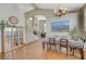 Elegant dining room with hardwood floors and a charming chandelier at 1259 Moon Vision St, Henderson, NV 89052