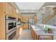 Modern kitchen with stainless steel appliances and light wood cabinetry at 1259 Moon Vision St, Henderson, NV 89052