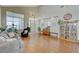 Bright living room featuring hardwood floors and a cozy seating area at 1259 Moon Vision St, Henderson, NV 89052