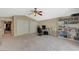 Home office with built-in shelving, desk, and ceiling fan at 1259 Moon Vision St, Henderson, NV 89052