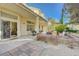 Spacious backyard patio with seating area and stone wall at 1259 Moon Vision St, Henderson, NV 89052