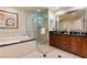 Luxurious bathroom with double vanity and large shower at 145 E Harmon Ave # 2215, Las Vegas, NV 89109