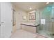 Bathroom with soaking tub and walk-in shower at 145 E Harmon Ave # 2215, Las Vegas, NV 89109