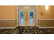 Elegant hallway with tile floors and carpet leading to rooms at 145 E Harmon Ave # 2215, Las Vegas, NV 89109