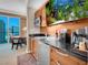 Small kitchen with modern appliances and a built-in aquarium at 145 E Harmon Ave # 2215, Las Vegas, NV 89109