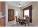 Dining area with a table and chairs near a china cabinet at 1518 Jenny Linn Dr # 105, Henderson, NV 89014