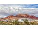 Aerial view showing homes and a hangar near mountains at 1556 Bryce Canyon St, Boulder City, NV 89005