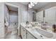 Modern bathroom with double sinks and a view of the bathtub at 1556 Bryce Canyon St, Boulder City, NV 89005