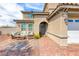 Brick entryway with seating area and welcoming front door at 1556 Bryce Canyon St, Boulder City, NV 89005