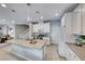 Bright kitchen features a large island, white cabinetry, and modern gas range at 1556 Bryce Canyon St, Boulder City, NV 89005