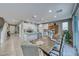 Modern kitchen with white cabinets, large island, and tile floor at 1556 Bryce Canyon St, Boulder City, NV 89005