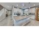 Modern kitchen with white cabinets, stainless steel appliances, and island at 1556 Bryce Canyon St, Boulder City, NV 89005