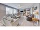 Relaxing living room with comfortable seating, large windows, and a built-in shelving unit at 1556 Bryce Canyon St, Boulder City, NV 89005