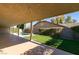 Covered patio overlooking a sparkling pool and grassy yard at 160 Swale Ln, Las Vegas, NV 89144