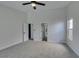 Large bedroom with carpet, ceiling fan, and access to other rooms at 160 Swale Ln, Las Vegas, NV 89144