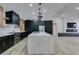 Modern kitchen featuring a large island and sleek black cabinetry at 160 Swale Ln, Las Vegas, NV 89144