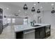 Modern kitchen island with white quartz countertops at 160 Swale Ln, Las Vegas, NV 89144