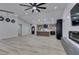 Open living room showcasing a kitchen with modern appliances and a fireplace at 160 Swale Ln, Las Vegas, NV 89144