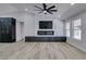 Spacious living room with modern fireplace and hardwood flooring at 160 Swale Ln, Las Vegas, NV 89144