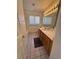 Bathroom with wood cabinets, bathtub and tiled floor at 1762 Sunflower Ct, Henderson, NV 89074