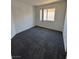 Spacious bedroom with grey carpet and window at 1762 Sunflower Ct, Henderson, NV 89074