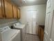 Laundry room with washer, dryer, and cabinets at 1762 Sunflower Ct, Henderson, NV 89074