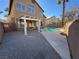 Inviting kidney-shaped pool with a pergola and spacious patio at 1762 Sunflower Ct, Henderson, NV 89074